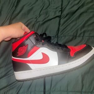 Jordan 1 Mid Sneakers in Black and Red